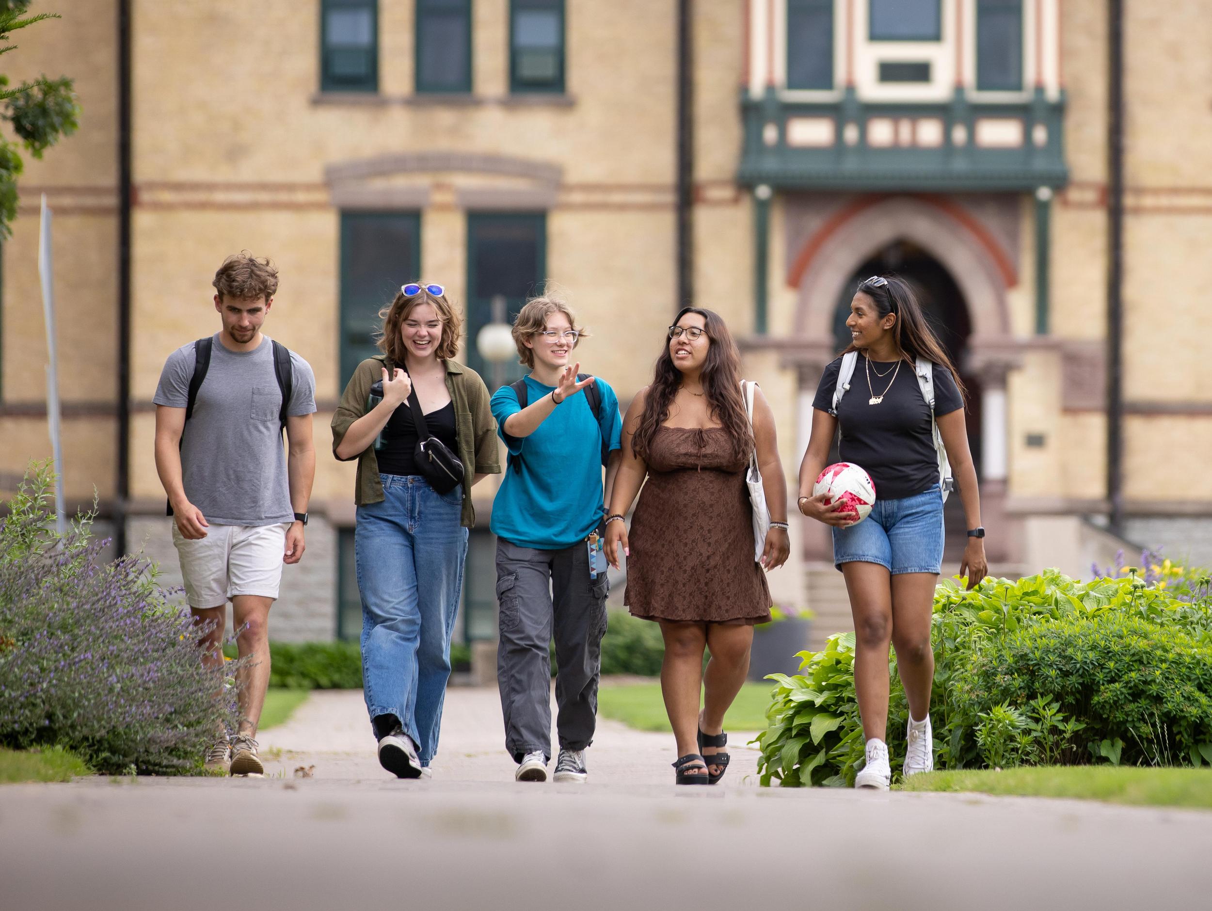 Students walking in front of Old Main