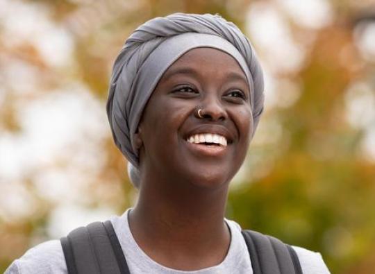 Asli Abdi a Hamline Student smilling to the picture