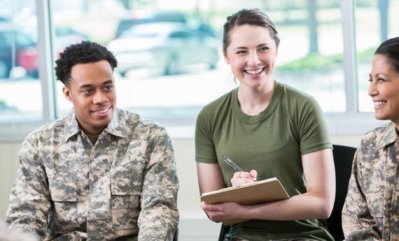 Three military students in a classroom 