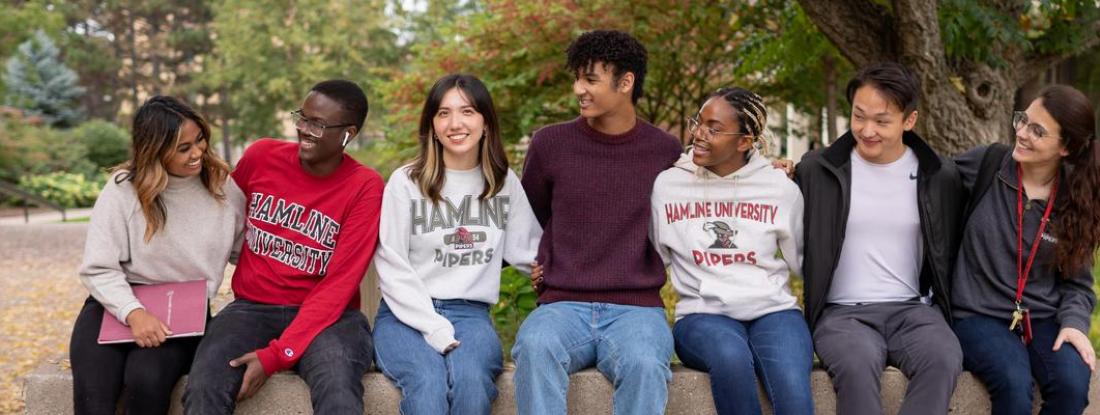 Hamline international students interacting with each other on campus