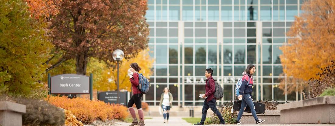 Hamline students walking in front o Klas Center building 