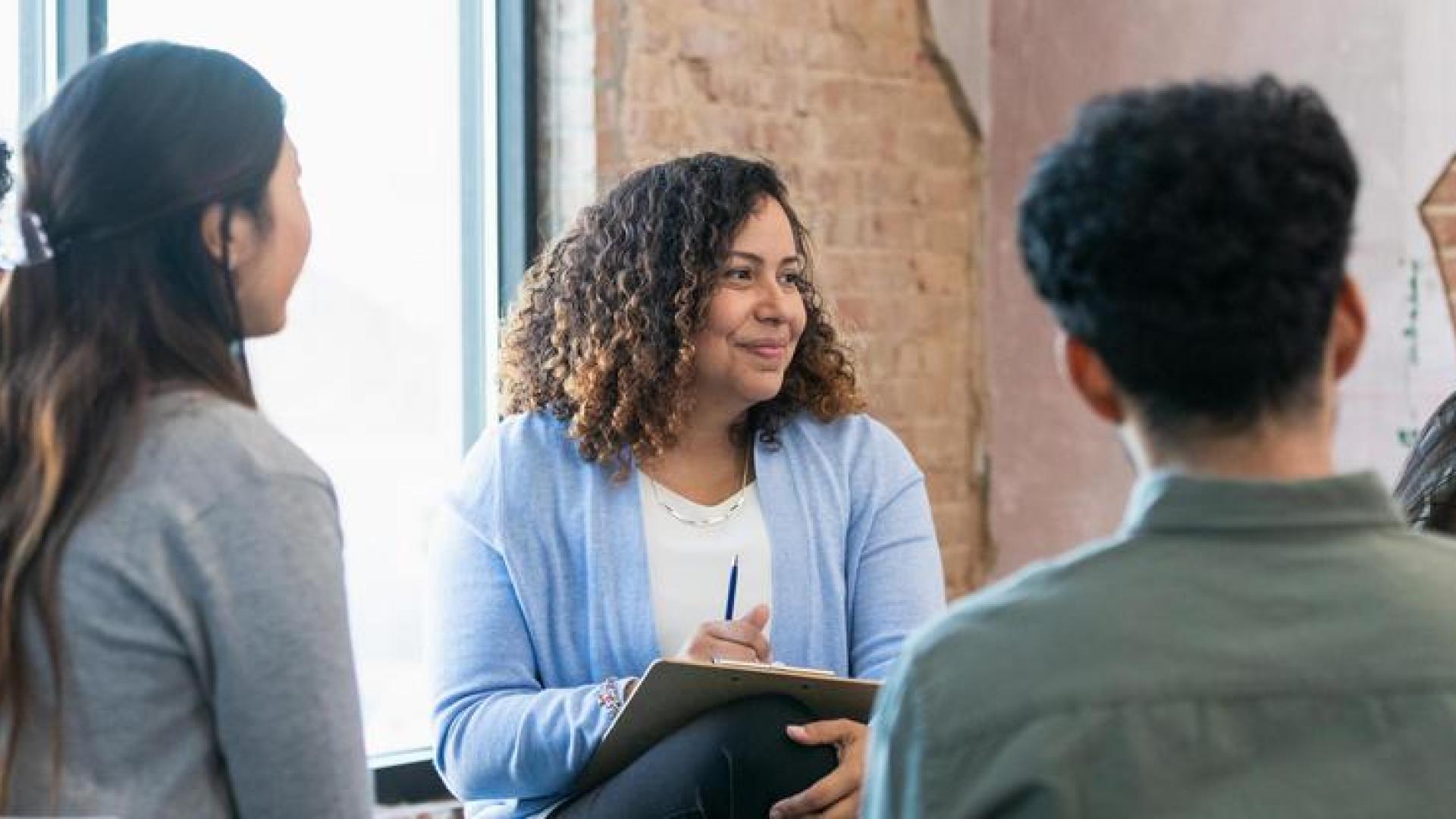 Photo of young adults participating in group therapy