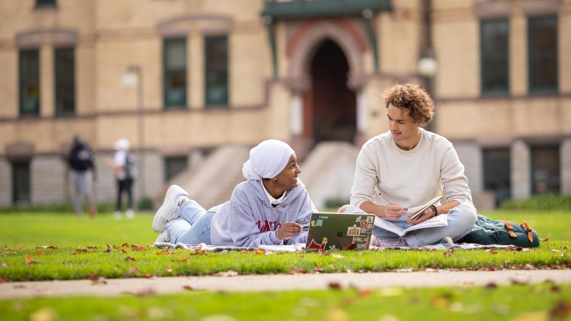 Hamline students lounging on lawn