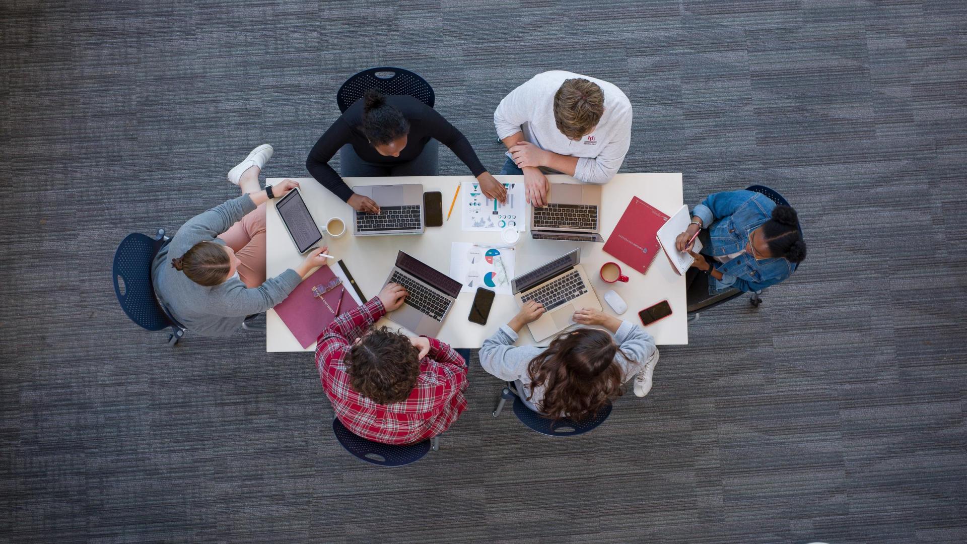 bird's eye view of Hamline students studying business