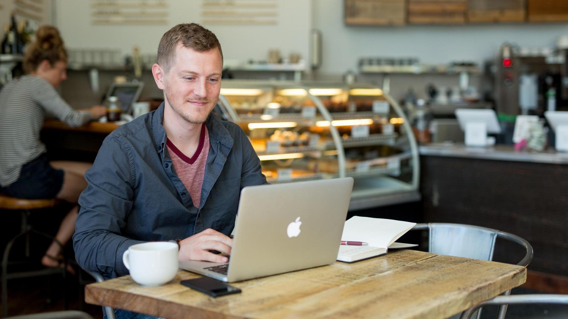 Online degree completion student at coffeeshop