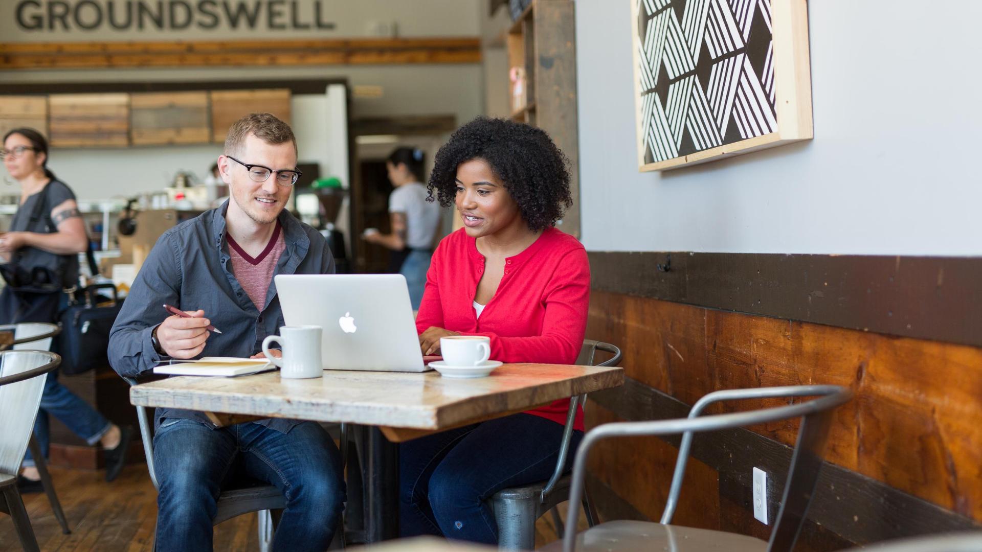 Two Hamline ODC students working in a coffeeshop