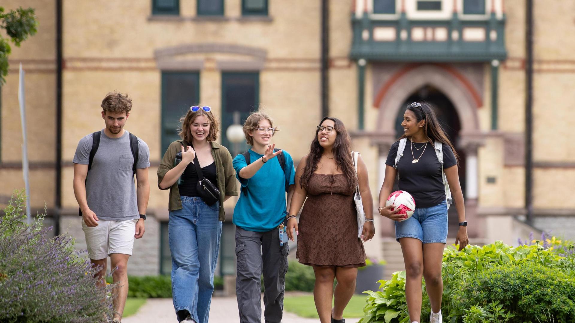 Students walking in front of Old Main