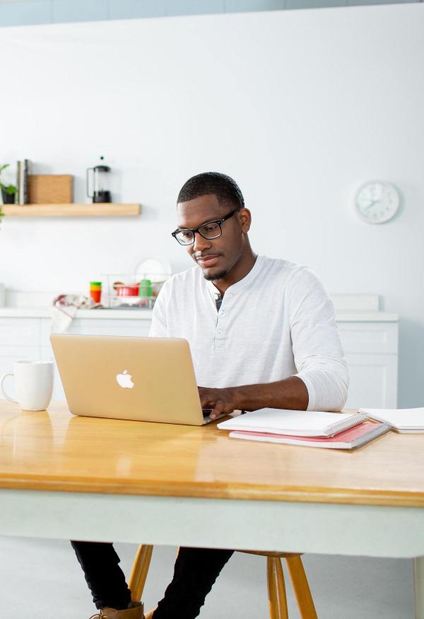 Online degree completion student working on laptop