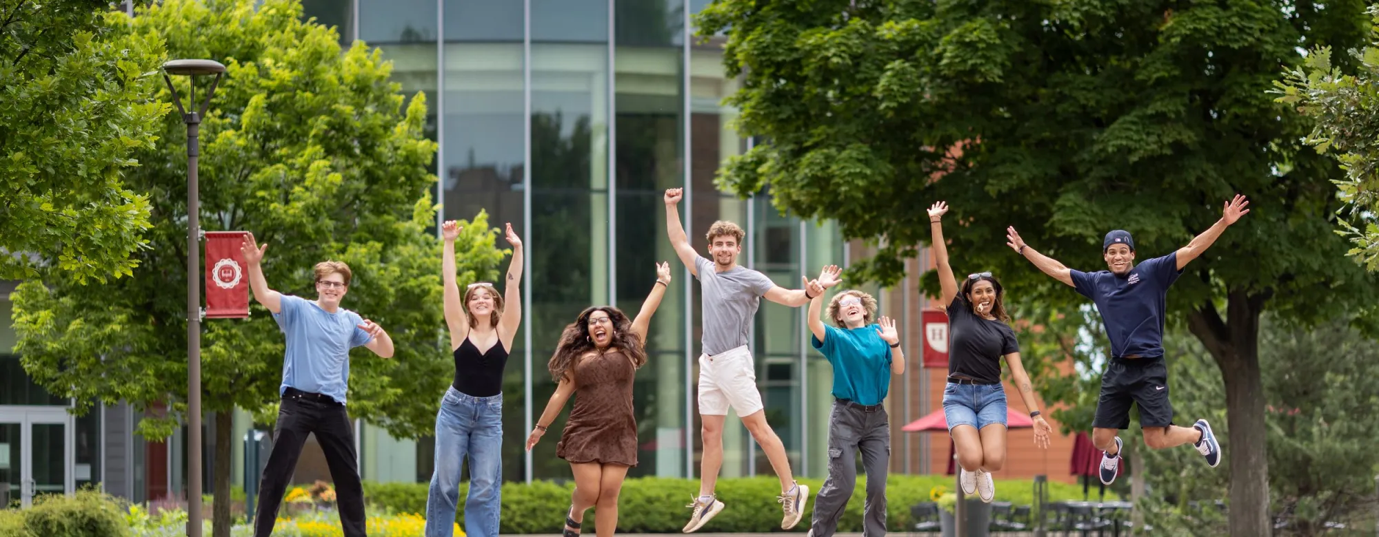 Homepage -- Hamline students jumping in front of Anderson Center