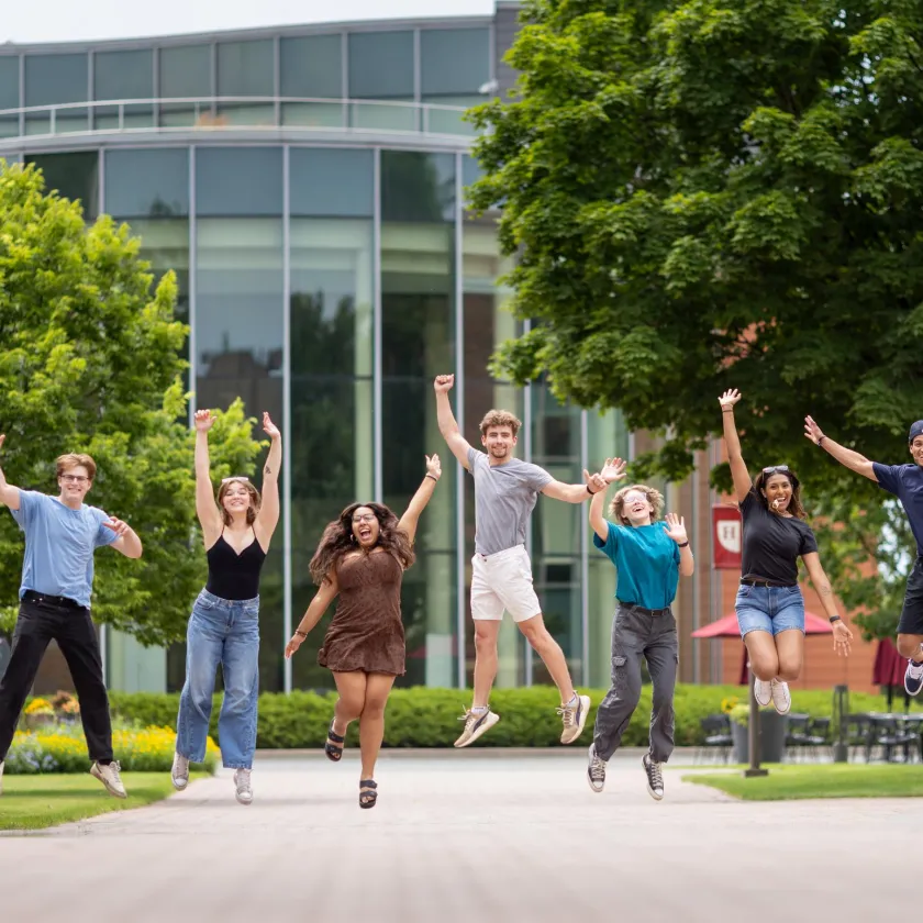 Homepage -- Hamline students jumping in front of Anderson Center